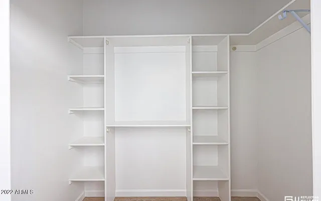 a view of an empty walk in closet