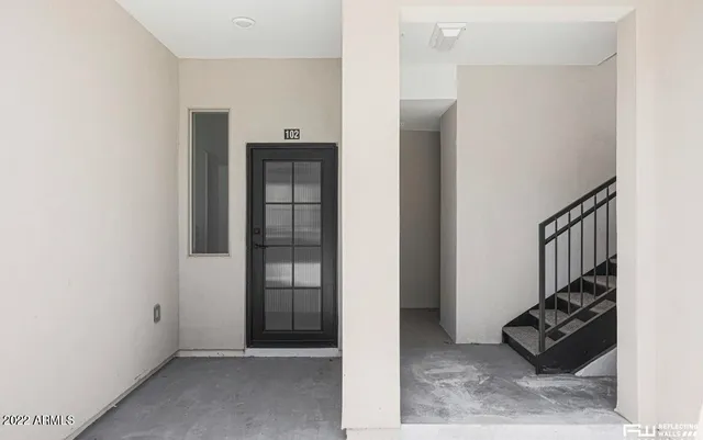 an entryway with a rug