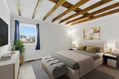a bedroom with bed and balcony