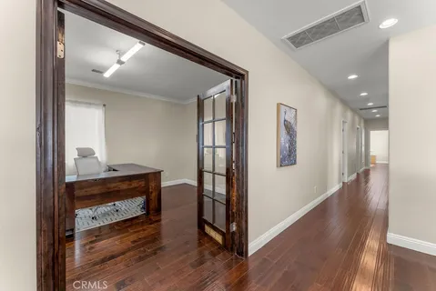 a room with a table and a book shelf