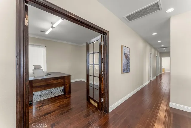a room with a table and a book shelf