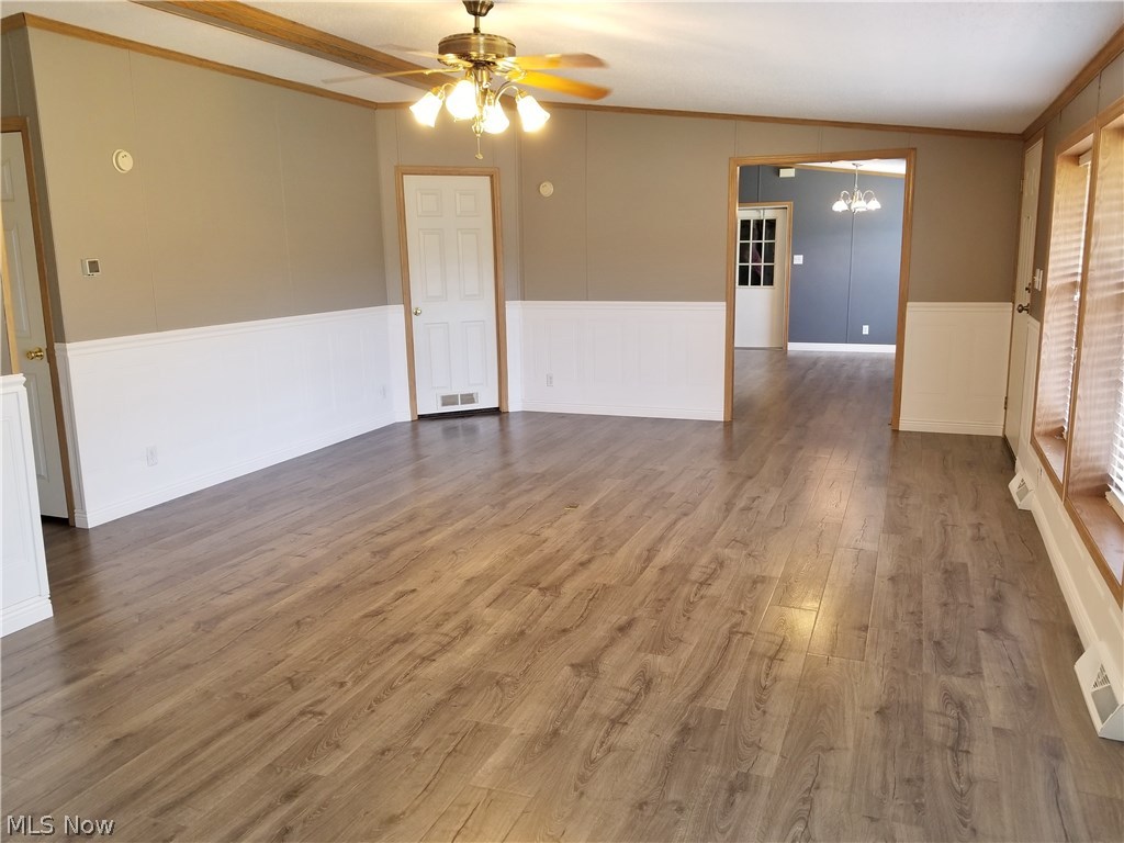 3216 Spider Ridge Road Parkersburg, WV 26104 - Photo 12 of 31 showing view from great room into kitchen with the waterproof Pergo flooring