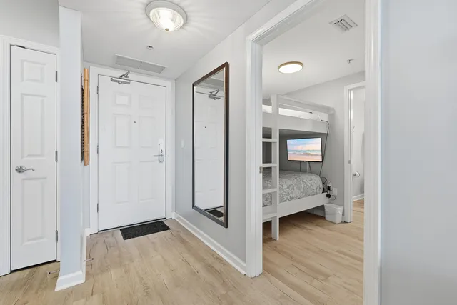 a bedroom with a bed and a view of bathroom