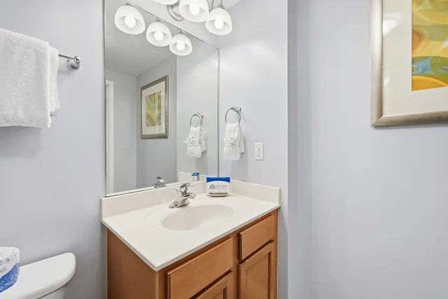 a bathroom with a glass shower door and a bathtub
