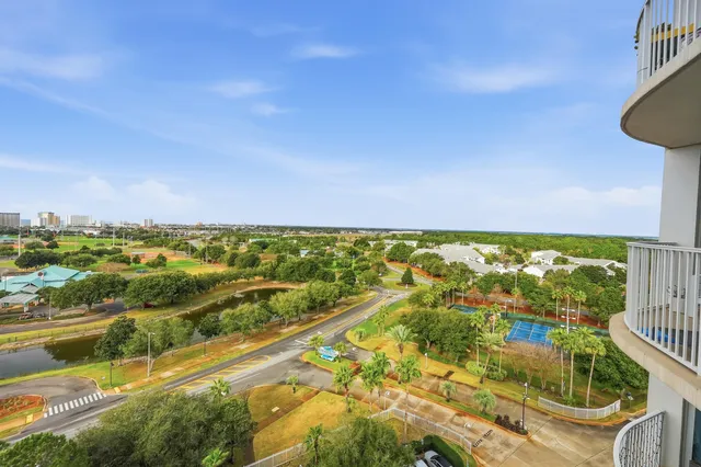 a view of a swimming pool with a yard and sitting area