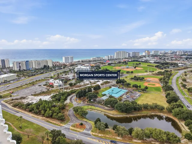 a view of a swimming pool with outdoor seating