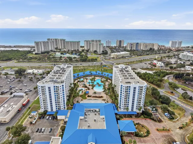 a view of a lobby with furniture and a chandelier