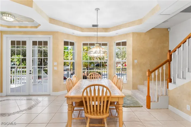 a view of a livingroom with furniture window wooden floor and windows