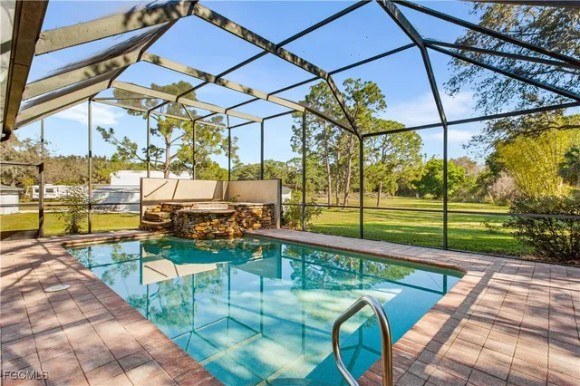 a view of a swimming pool with a patio