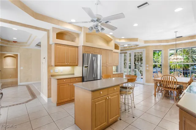 a open kitchen with stainless steel appliances granite countertop a sink and cabinets