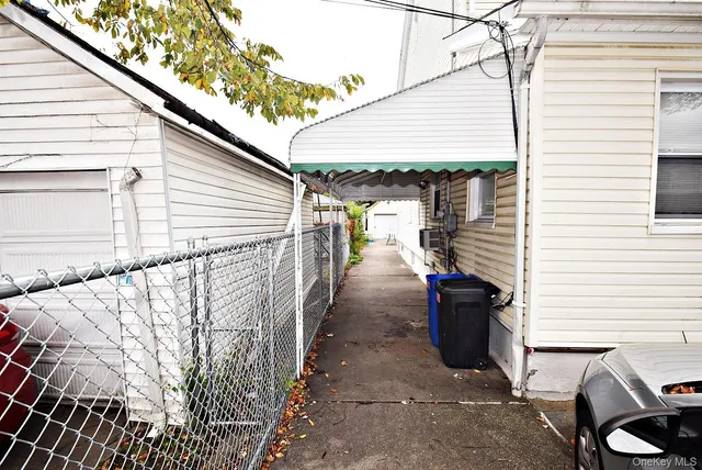 a view of a patio with wooden fence