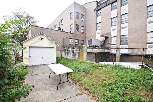 a front view of a house with a yard and outdoor seating