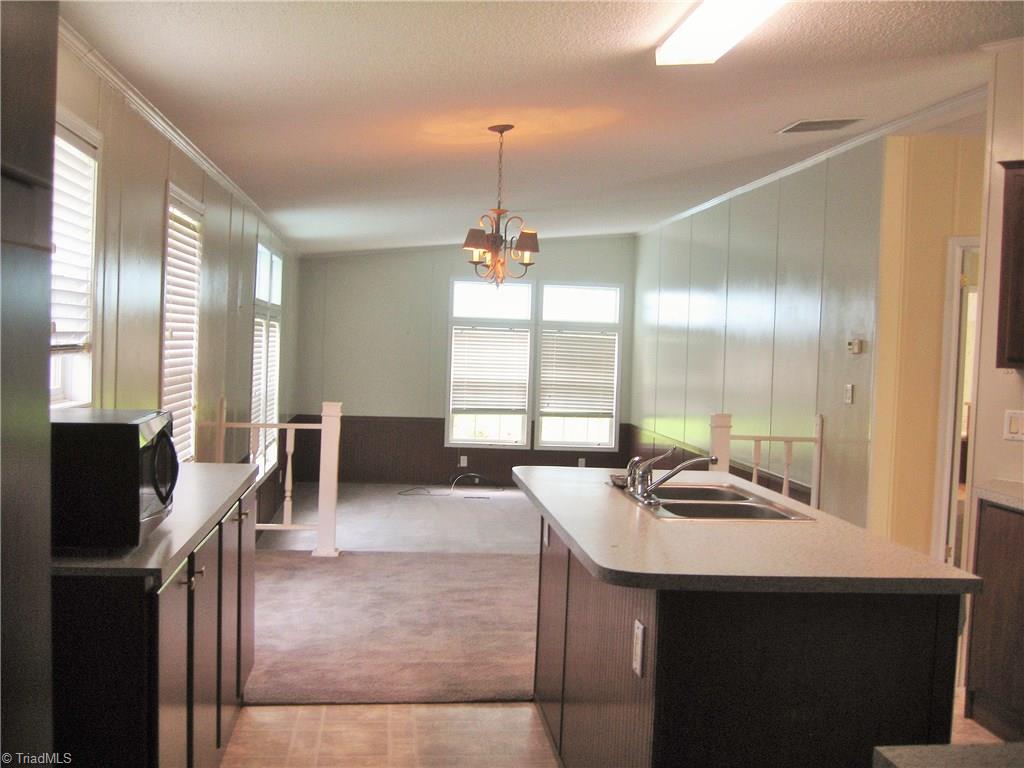 330 Crumpton Road Reidsville, NC 27320 - Photo 24 of 28 View of kitchen, dining and sunken den.
