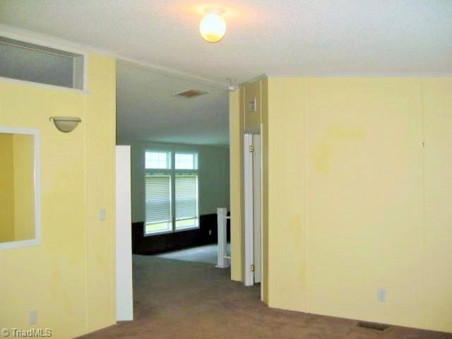 330 Crumpton Road Reidsville, NC 27320 - Photo 25 of 28 View of living room, dining area and den.