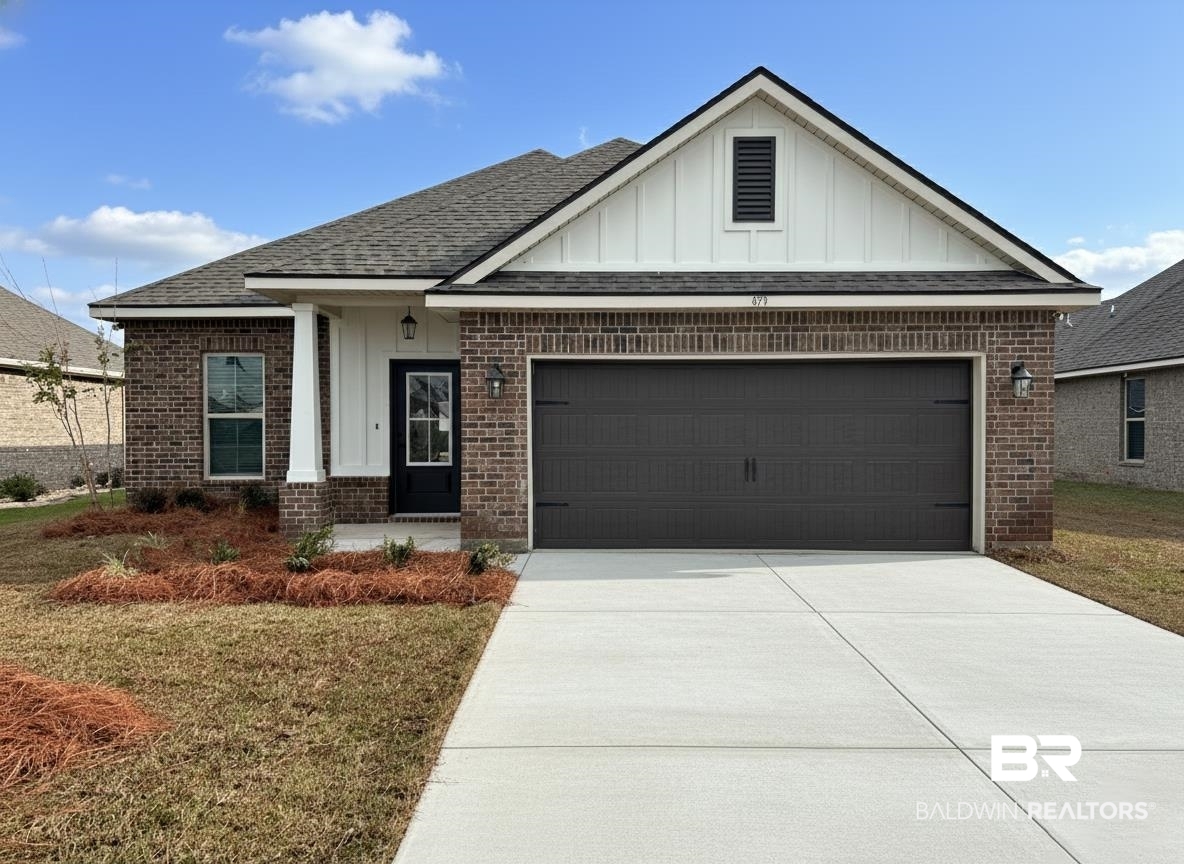 873 Sumter Loop Foley, AL 36535 - Photo 1 of 26 Brick exterior with white board-and-batten gables, a dark asphalt shingle roof, a two-car garage with a dark panel door, a concrete driveway, and a covered porch entry featuring a white column