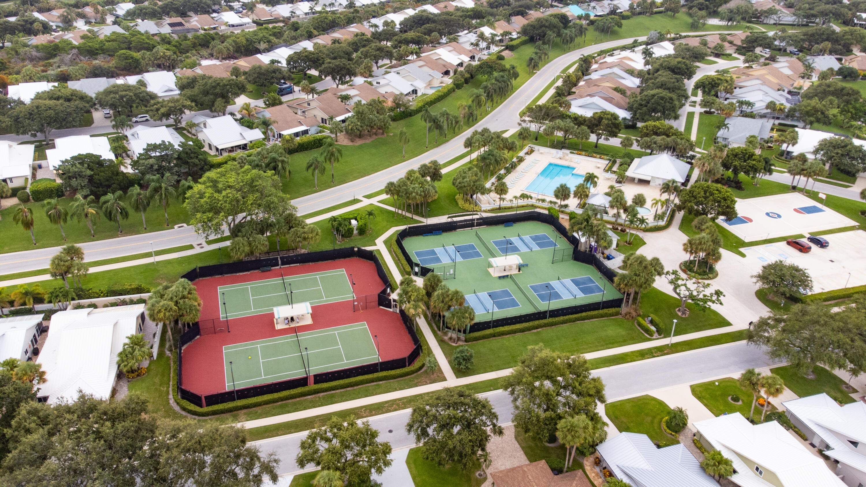 114 Beach Summit Court Jupiter, FL 33477 - Photo 91 of 97 an aerial view of residential houses with outdoor space and trees