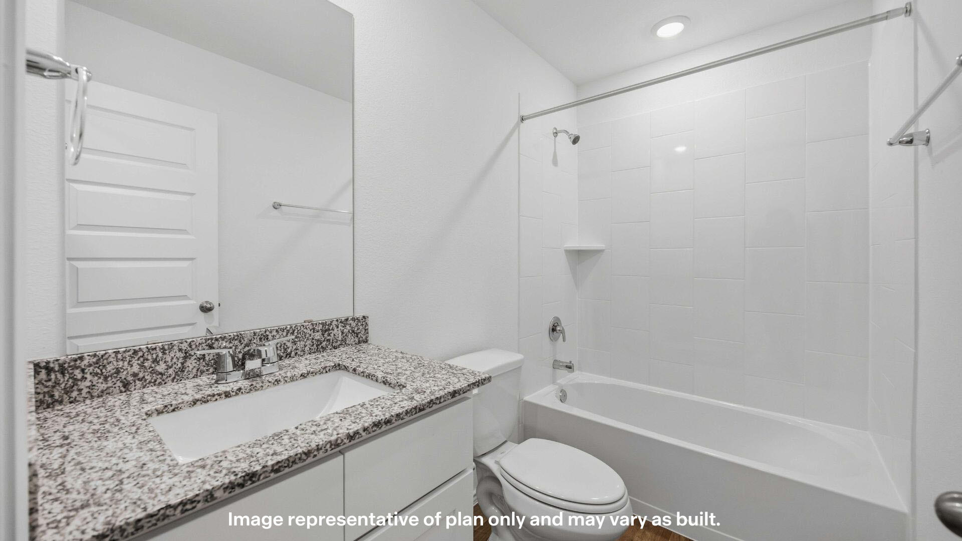 7441 10th Street Lubbock, TX 79416 - Photo 8 of 25 a bathroom with a granite countertop sink toilet and shower