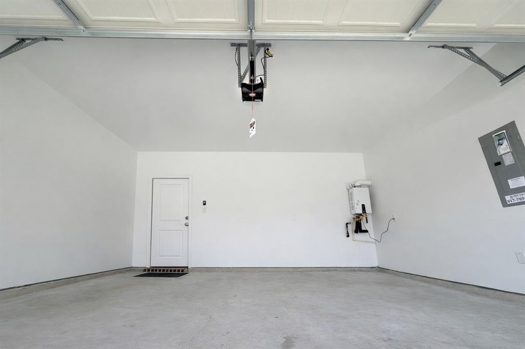 3017 Dutch Road Providence Village, TX 76227 - Photo 12 of 32 Garage with electric panel
