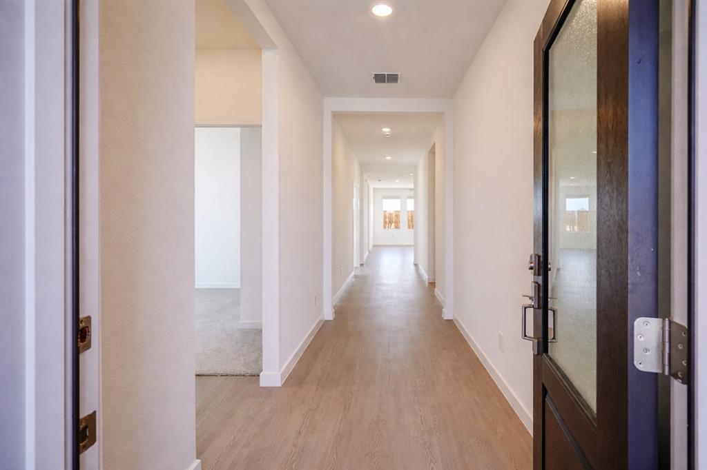 3017 Dutch Road Providence Village, TX 76227 - Photo 3 of 32 Corridor featuring light wood-style floors and recessed lighting