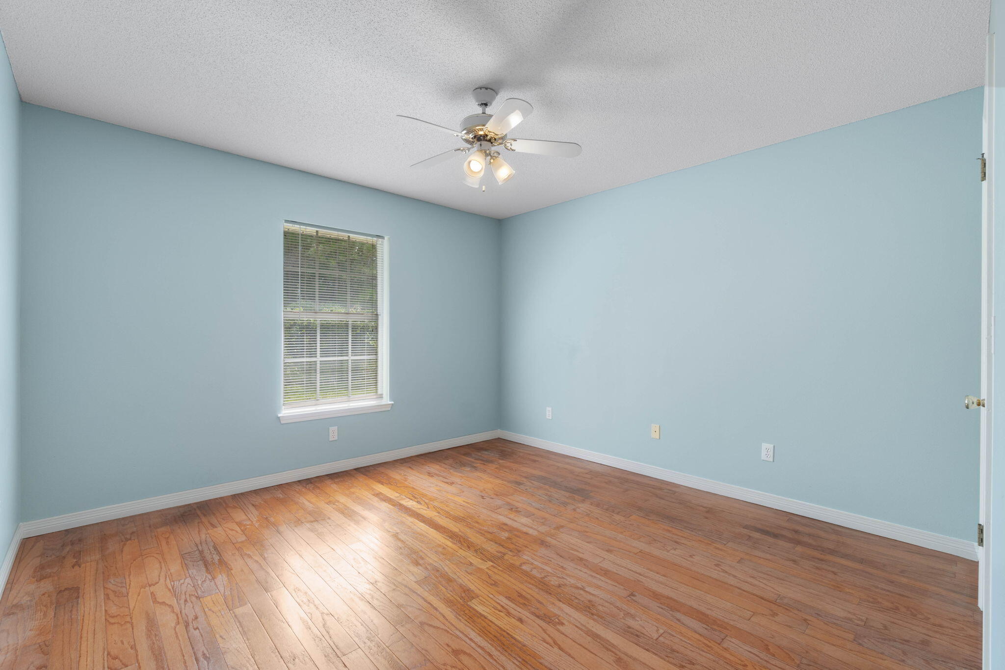 3816 Indigo Circle Destin, FL 32541 - Photo 16 of 36 wooden floor in an empty room with a window