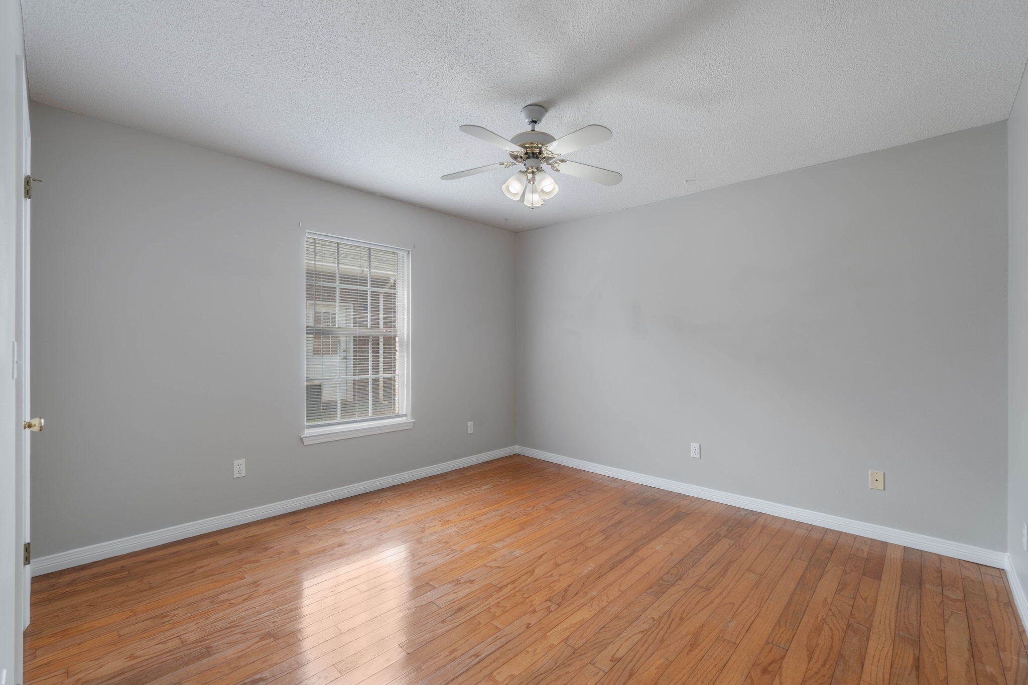 3816 Indigo Circle Destin, FL 32541 - Photo 20 of 36 wooden floor in an empty room with a window