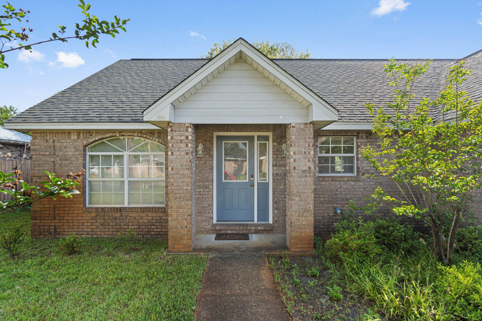 3816 Indigo Circle Destin, FL 32541 - Photo 2 of 36 a front view of a house with garden