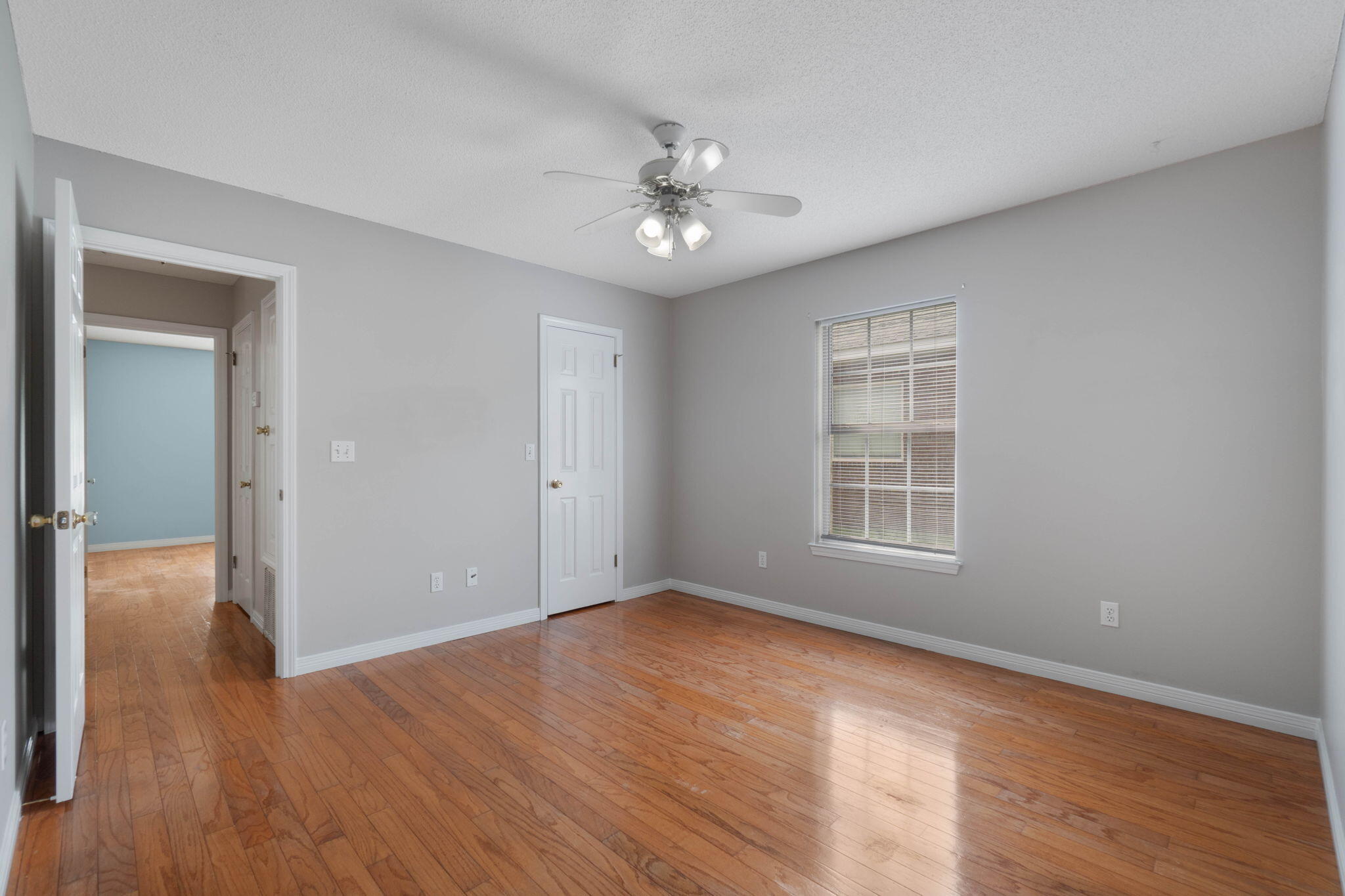 3816 Indigo Circle Destin, FL 32541 - Photo 21 of 36 a view of an empty room with wooden floor and a window