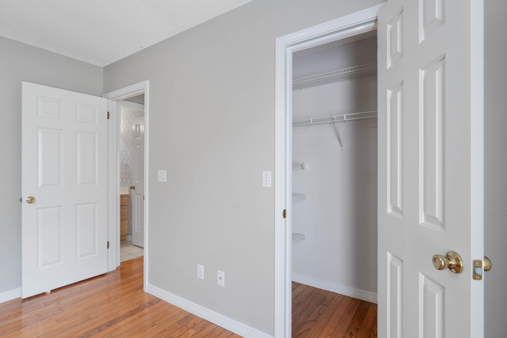 3816 Indigo Circle Destin, FL 32541 - Photo 22 of 36 a view of a hallway with wooden floor