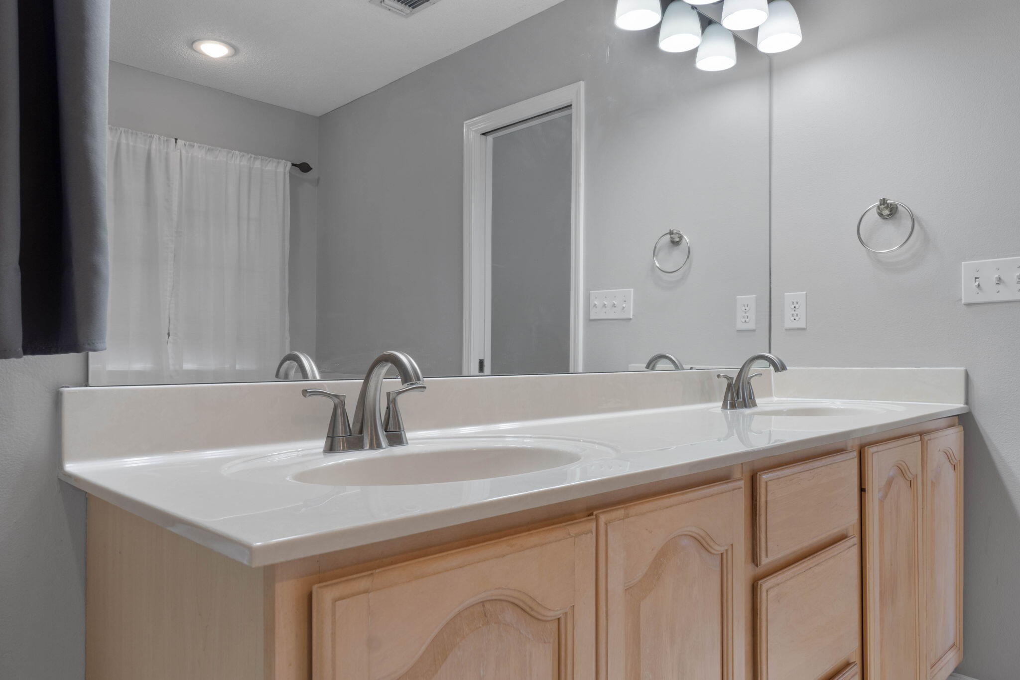 3816 Indigo Circle Destin, FL 32541 - Photo 29 of 36 a bathroom with a sink and a mirror