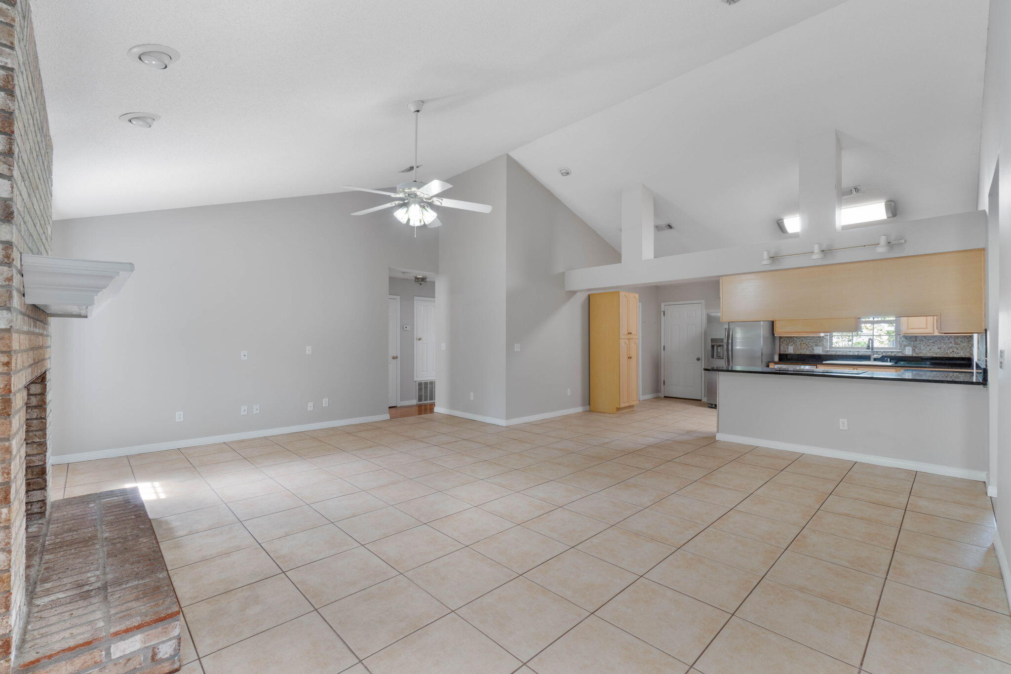 3816 Indigo Circle Destin, FL 32541 - Photo 8 of 36 a view of a kitchen with a sink and a stove top oven