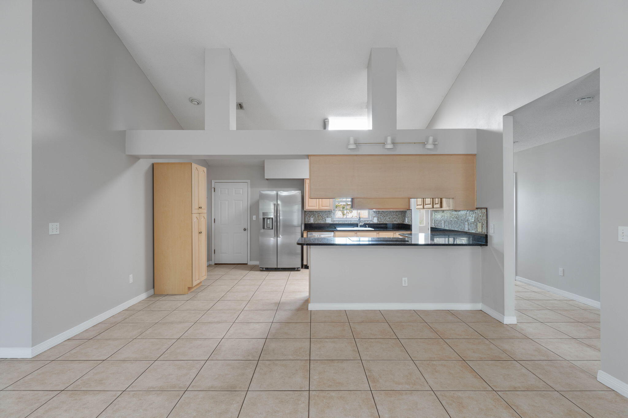 3816 Indigo Circle Destin, FL 32541 - Photo 10 of 36 a kitchen with a sink a stove and cabinets