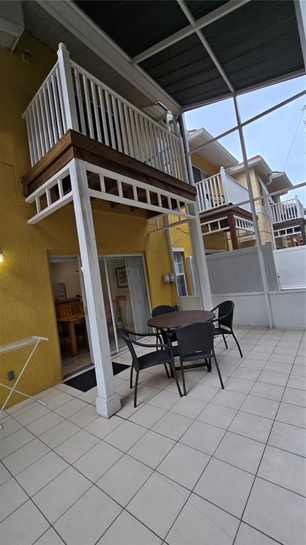 1013 Park Ridge Circle Kissimmee, FL 34746 - Photo 18 of 74 a view of deck with table and chairs with wooden floor