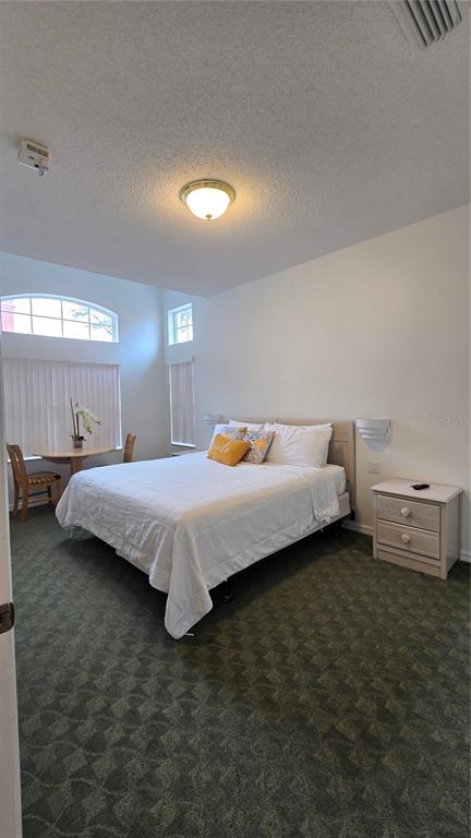 1013 Park Ridge Circle Kissimmee, FL 34746 - Photo 22 of 74 a bedroom with bed and window