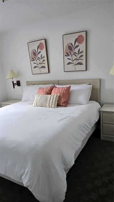 1013 Park Ridge Circle Kissimmee, FL 34746 - Photo 34 of 74 a bedroom with a bed and painting on the wall