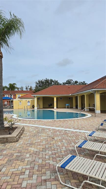 1013 Park Ridge Circle Kissimmee, FL 34746 - Photo 46 of 74 a front view of a house with a yard