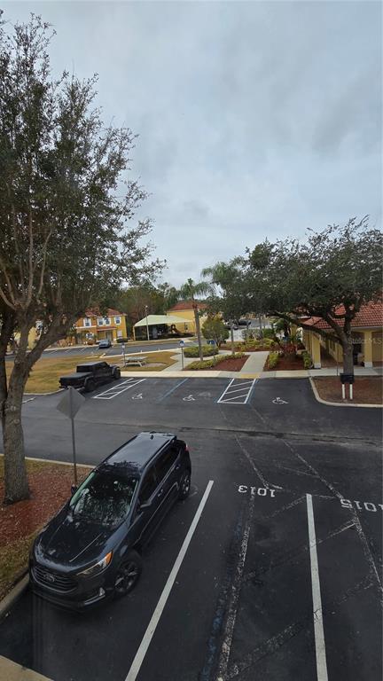 1013 Park Ridge Circle Kissimmee, FL 34746 - Photo 48 of 74 a view of a city street with cars