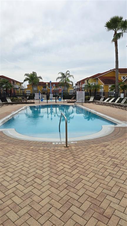 1013 Park Ridge Circle Kissimmee, FL 34746 - Photo 52 of 74 a view of swimming pool with a terrace