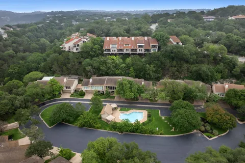 a view of a swimming pool and lounge chair