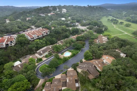 an aerial view of house with yard swimming pool and outdoor seating