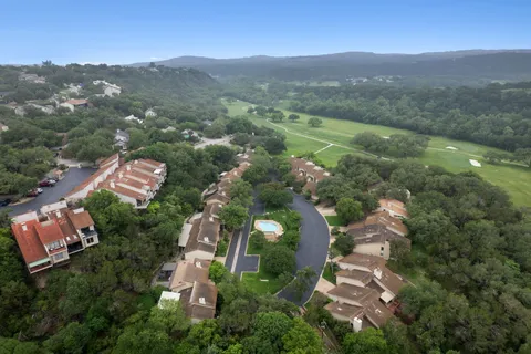 an aerial view of residential house with outdoor space and mountain view