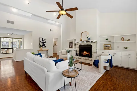 a living room with furniture and a fireplace