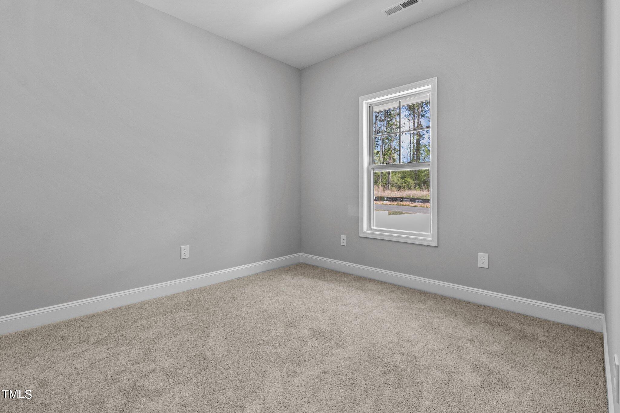75 Regis Lane Coats, NC 27521 - Photo 17 of 37 an empty room with a window