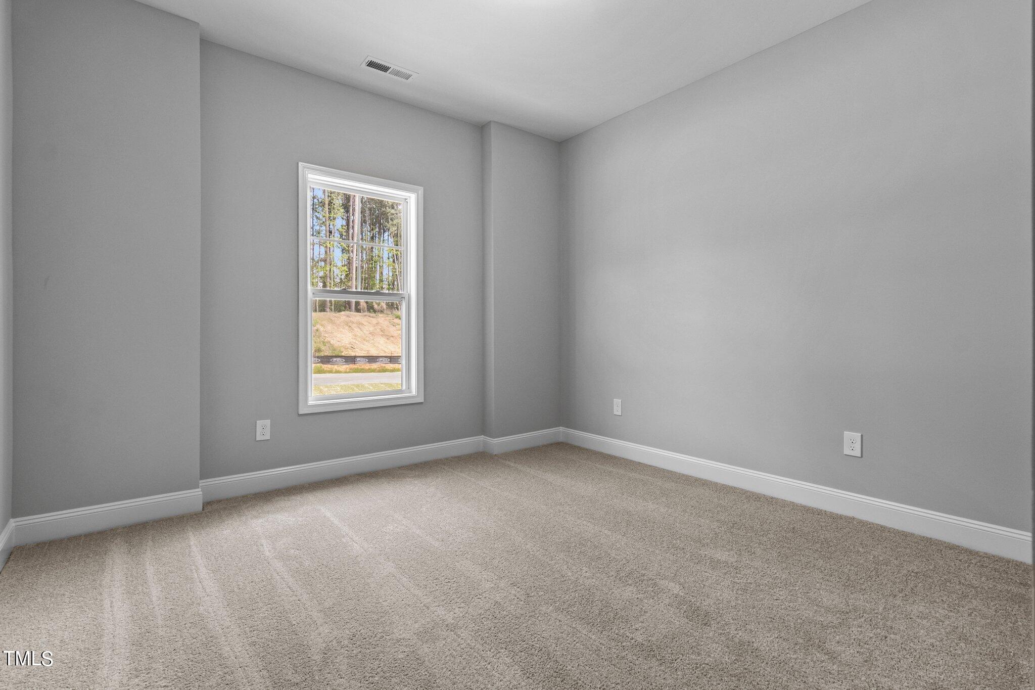 75 Regis Lane Coats, NC 27521 - Photo 19 of 37 a view of an empty room with a window