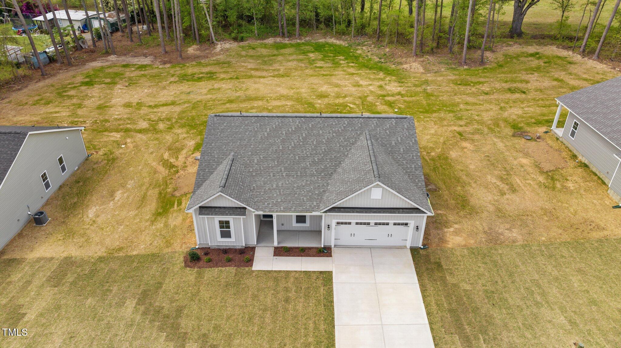 75 Regis Lane Coats, NC 27521 - Photo 2 of 37 a view of residential house with pool