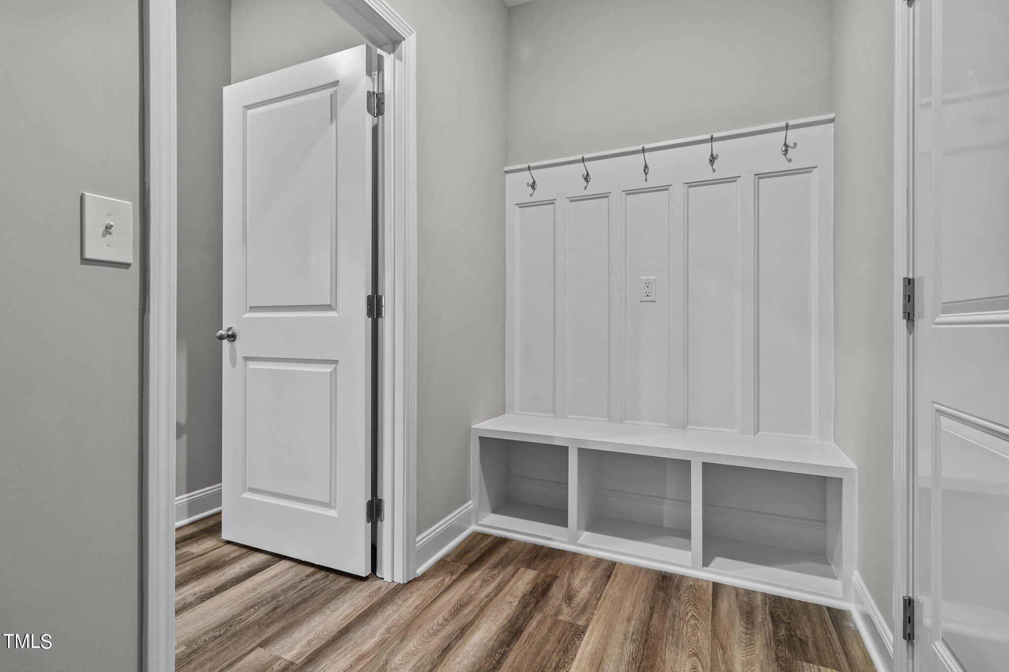 75 Regis Lane Coats, NC 27521 - Photo 23 of 37 a view of an empty walk in closet with wooden floor