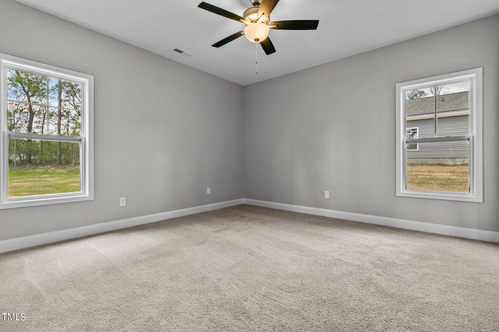 75 Regis Lane Coats, NC 27521 - Photo 25 of 37 a view of an empty room with a window