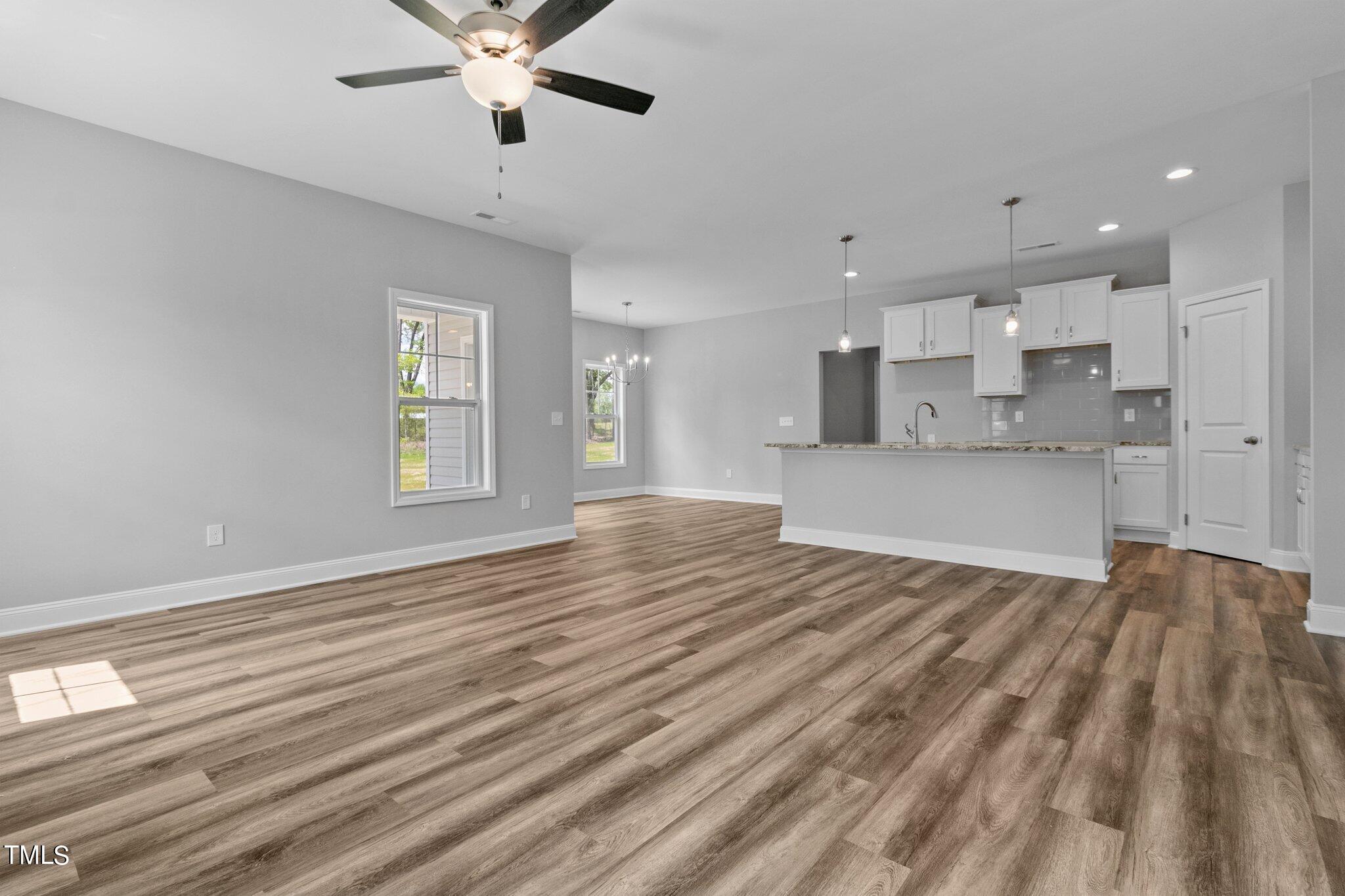 75 Regis Lane Coats, NC 27521 - Photo 6 of 37 a view of an empty room with window and wooden floor