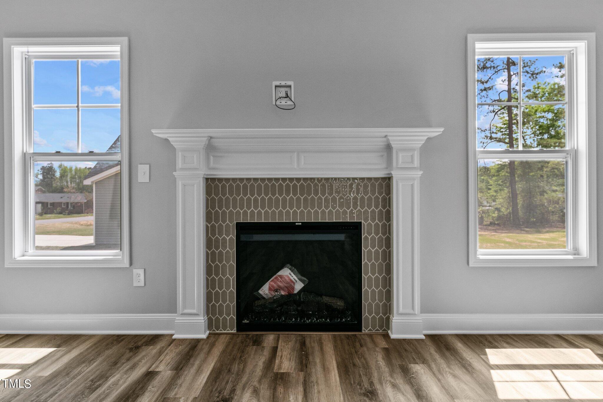 75 Regis Lane Coats, NC 27521 - Photo 9 of 37 a living room with a fireplace and a window