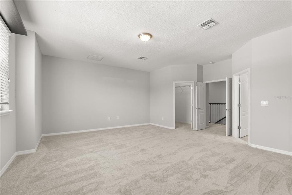 4345 Saltmarsh Sparrow Drive Windermere, FL 34786 - Photo 25 of 46 a view of an empty room with a window