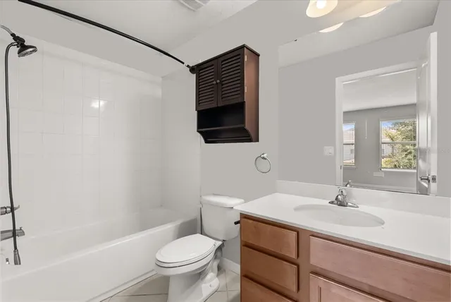 a bathroom with a sink a toilet and a bathtub